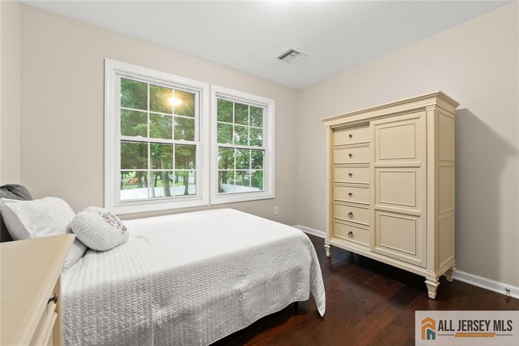 227 Temple Way Colonia, NJ 07067 - Photo 17 of 30 a bedroom with a bed and a dresser