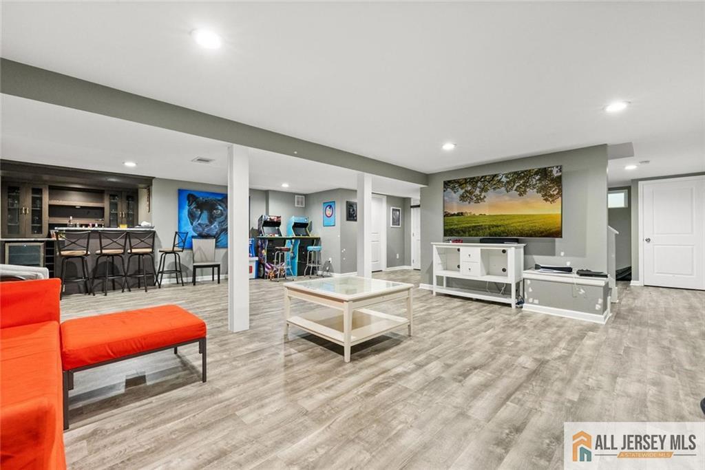 227 Temple Way Colonia, NJ 07067 - Photo 20 of 30 a living room with furniture pool table and flat screen tv