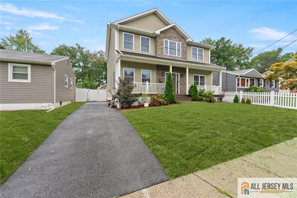 227 Temple Way Colonia, NJ 07067 - Photo 2 of 30 a front view of a house with a yard