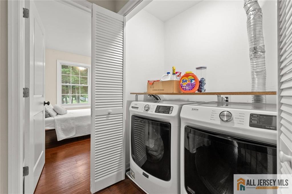 227 Temple Way Colonia, NJ 07067 - Photo 22 of 30 a utility room with dryer and washer