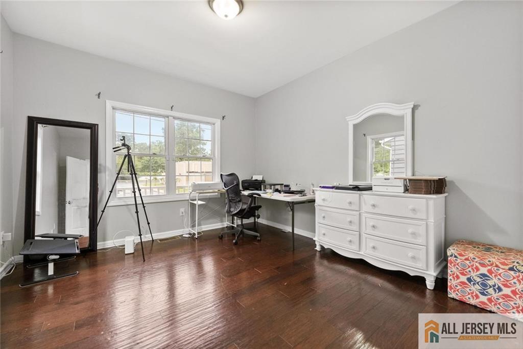 227 Temple Way Colonia, NJ 07067 - Photo 8 of 30 a view of a workspace with furniture and a window