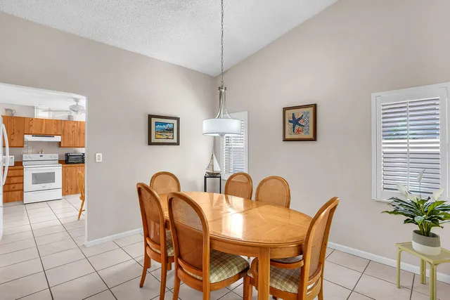 a view of a dining room with furniture and window