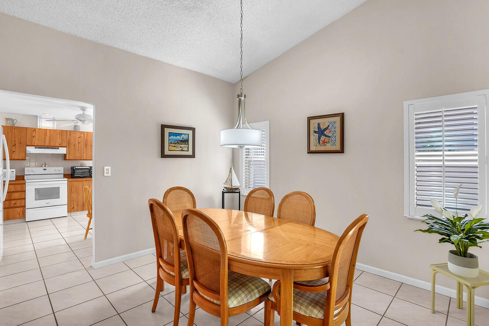 1550 Northwest 22nd Avenue Delray Beach, FL 33445 - Photo 17 of 44 a view of a dining room with furniture and window