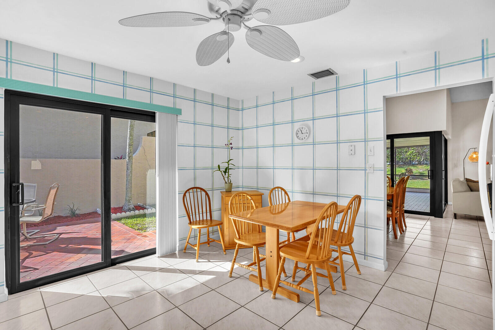 1550 Northwest 22nd Avenue Delray Beach, FL 33445 - Photo 20 of 44 a view of a dining room with furniture and chandelier