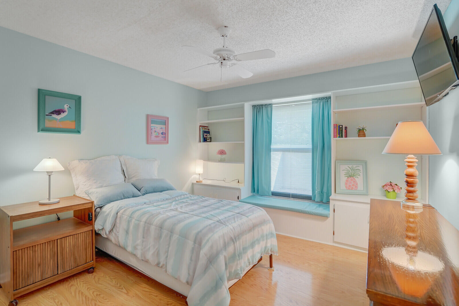 1550 Northwest 22nd Avenue Delray Beach, FL 33445 - Photo 23 of 44 a spacious bedroom with a bed and a lamp