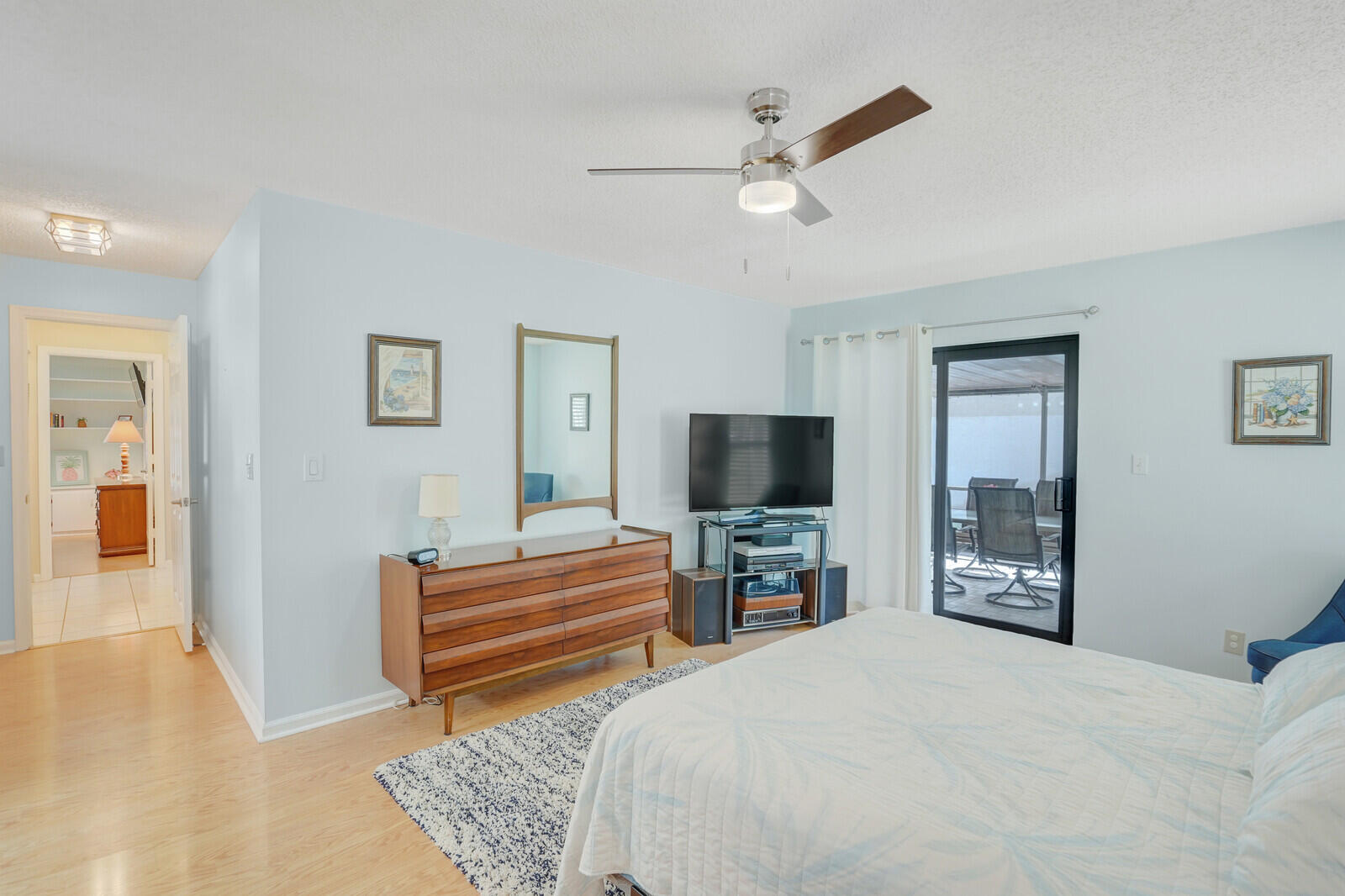 1550 Northwest 22nd Avenue Delray Beach, FL 33445 - Photo 27 of 44 a bedroom with a bed and a flat screen tv