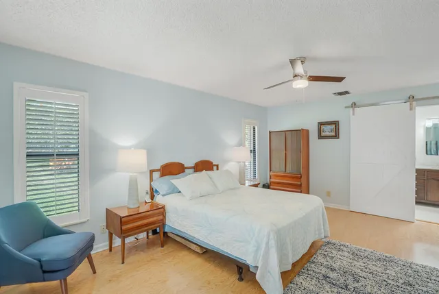 a bedroom with a bed and a couch