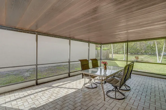 a dining room with furniture and outdoor view