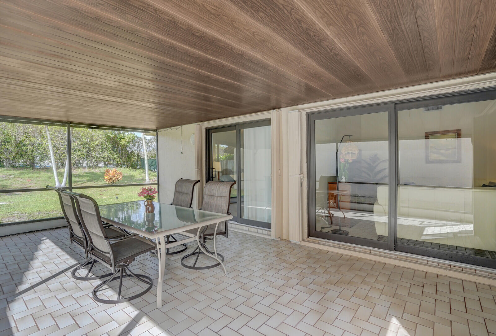 1550 Northwest 22nd Avenue Delray Beach, FL 33445 - Photo 31 of 44 a view of a dining room with furniture wooden floor and next to a window
