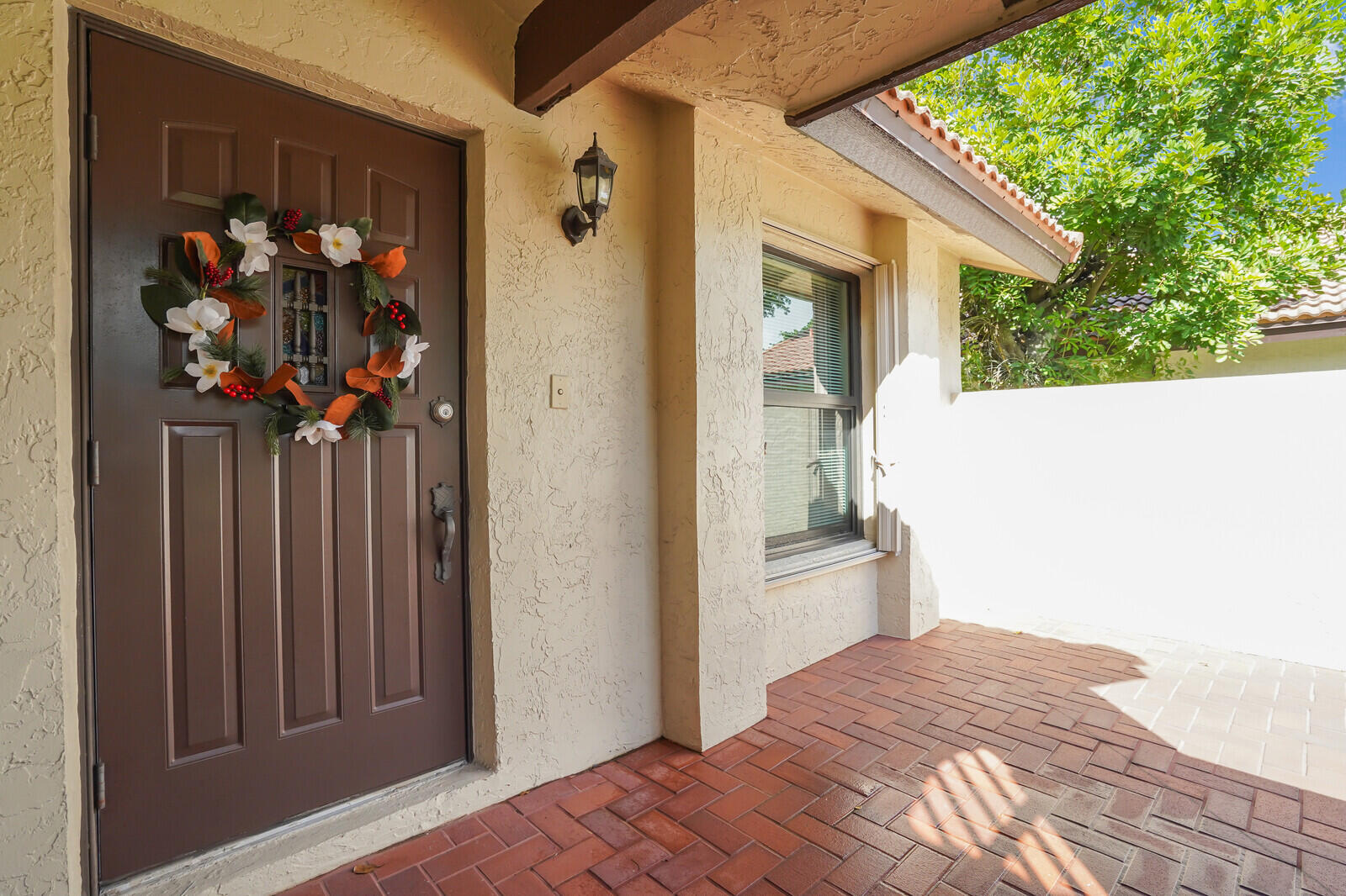 1550 Northwest 22nd Avenue Delray Beach, FL 33445 - Photo 6 of 44 a view of a house with a porch