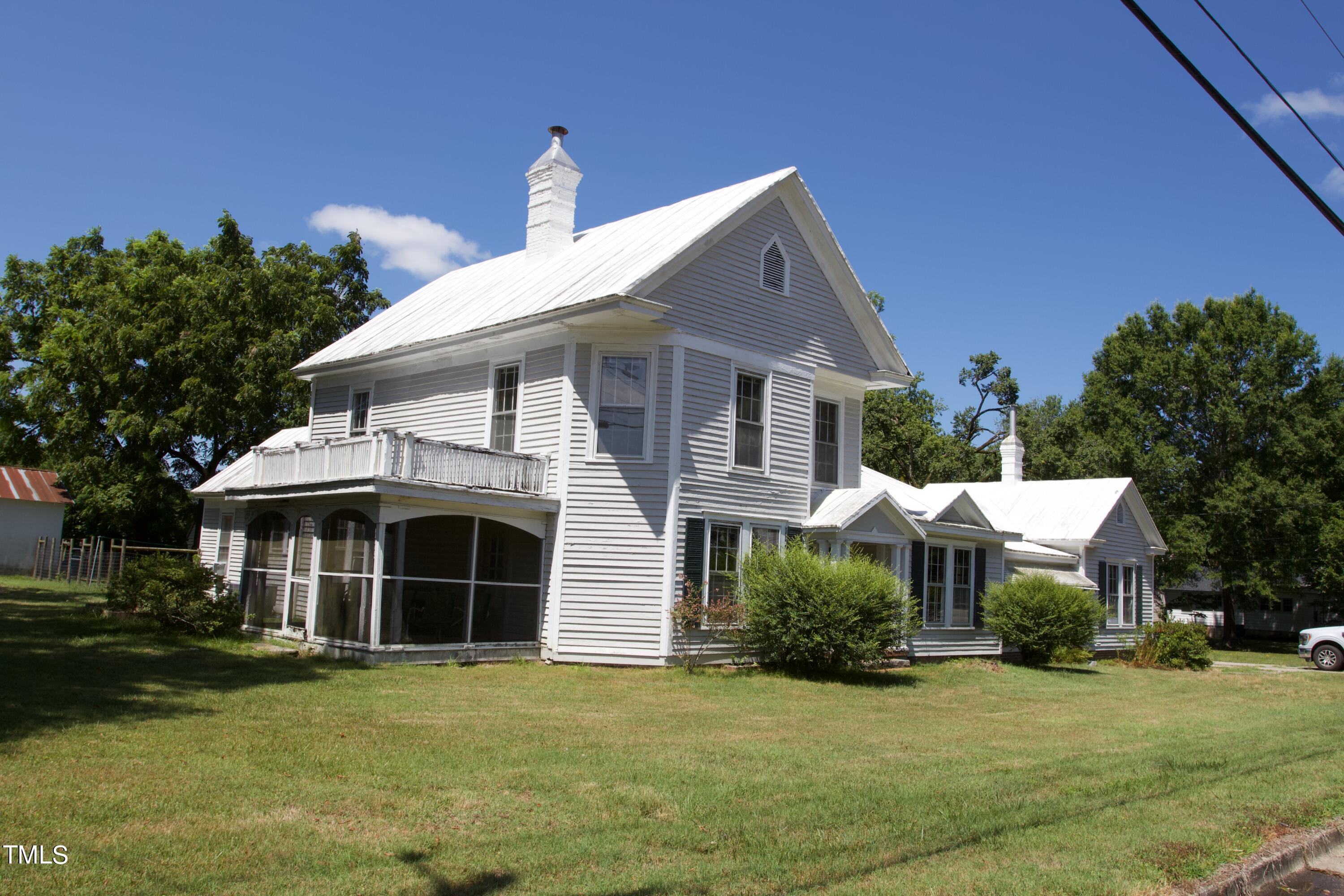 9358 Main Street Castalia, NC 27816 - Photo 1 of 20 a front view of a house with a yard and garage