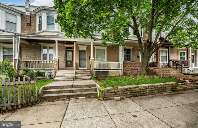 front view of a house with a garden