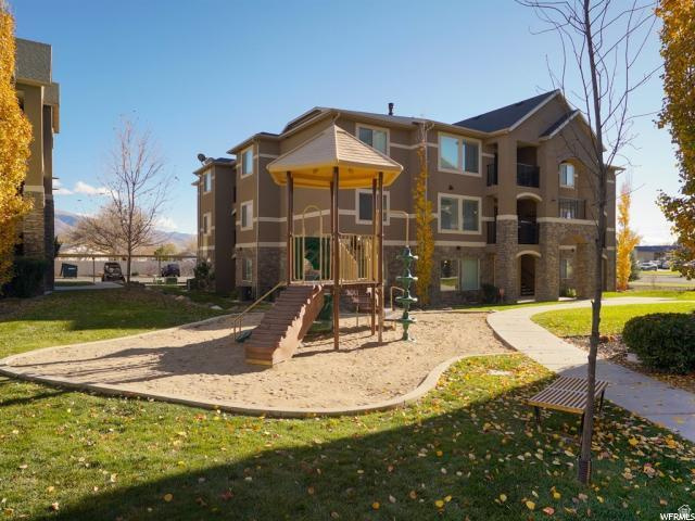 917 South Main Street, Unit H Layton, UT 84041 - Photo 1 of 19 Community jungle gym featuring a yard