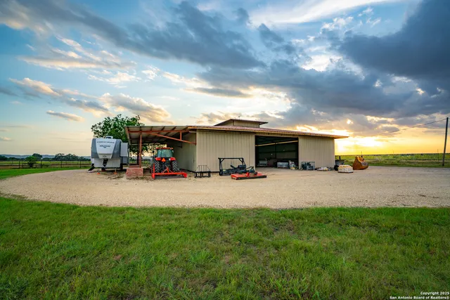 a view of a house with backyard and porch