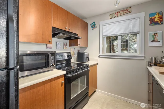 a kitchen with a stove and a microwave