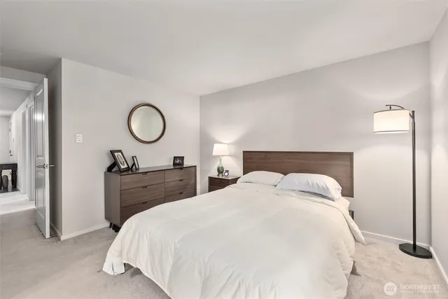 a bedroom with a bed and a closet