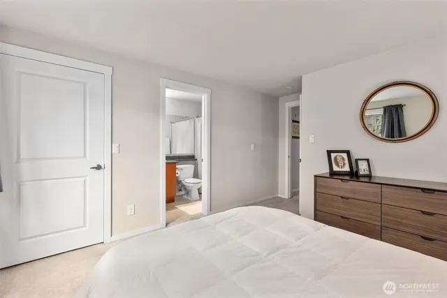 a bedroom with a bed and a sink