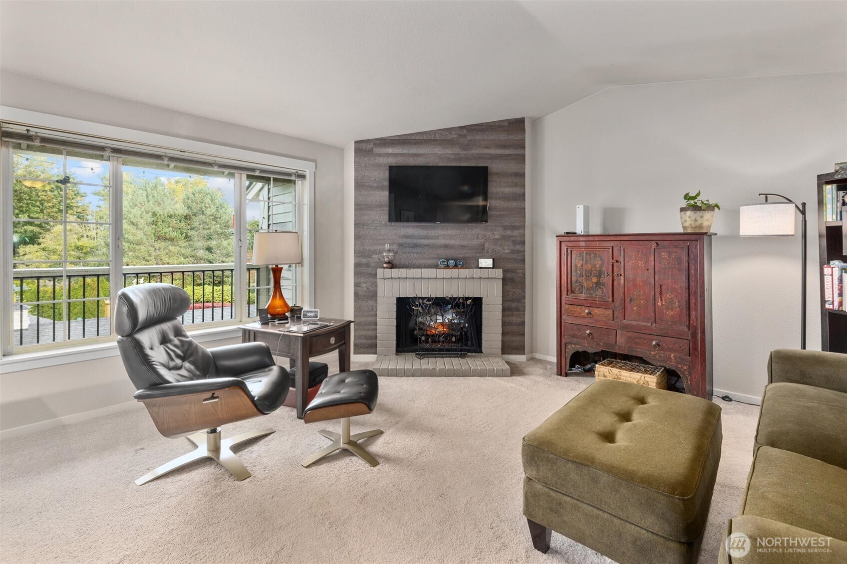 12404 East Gibson Road, Unit H301 Everett, WA 98204 - Photo 7 of 36 a living room with furniture and a fireplace