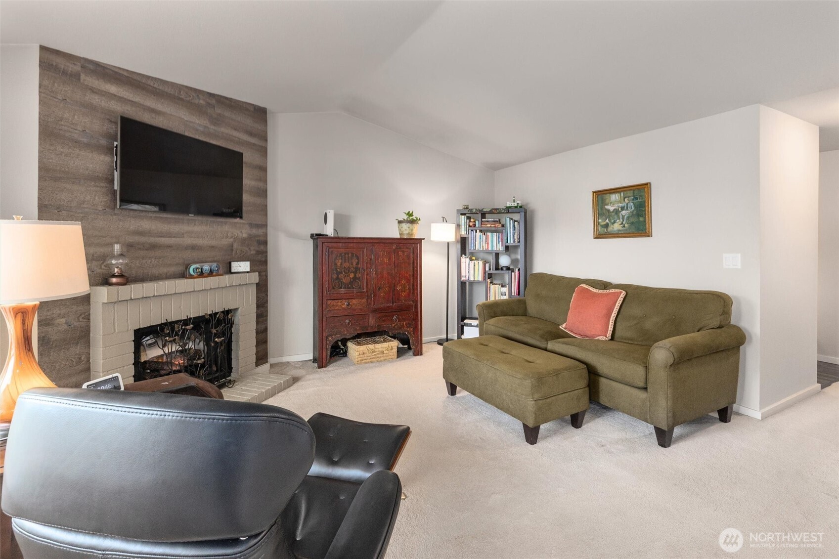 12404 East Gibson Road, Unit H301 Everett, WA 98204 - Photo 8 of 36 a living room with furniture a flat screen tv and a fireplace