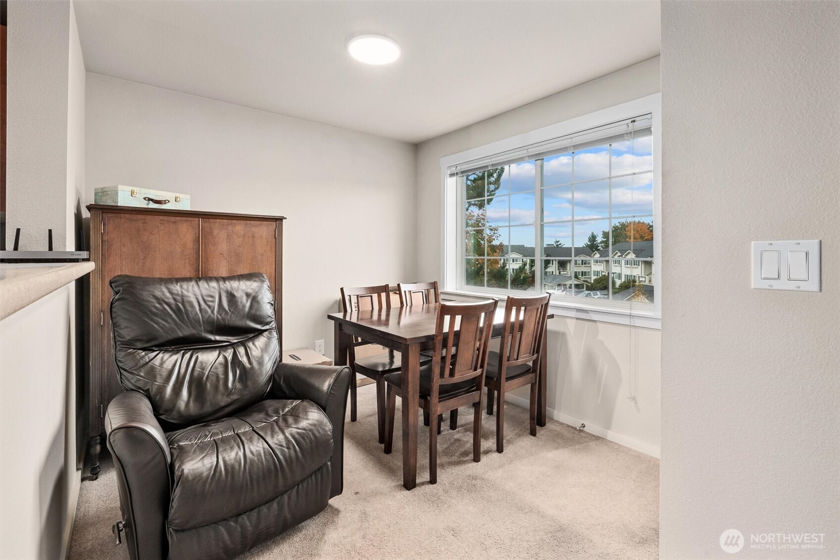 12404 East Gibson Road, Unit H301 Everett, WA 98204 - Photo 10 of 36 a view of a livingroom with furniture and a large window