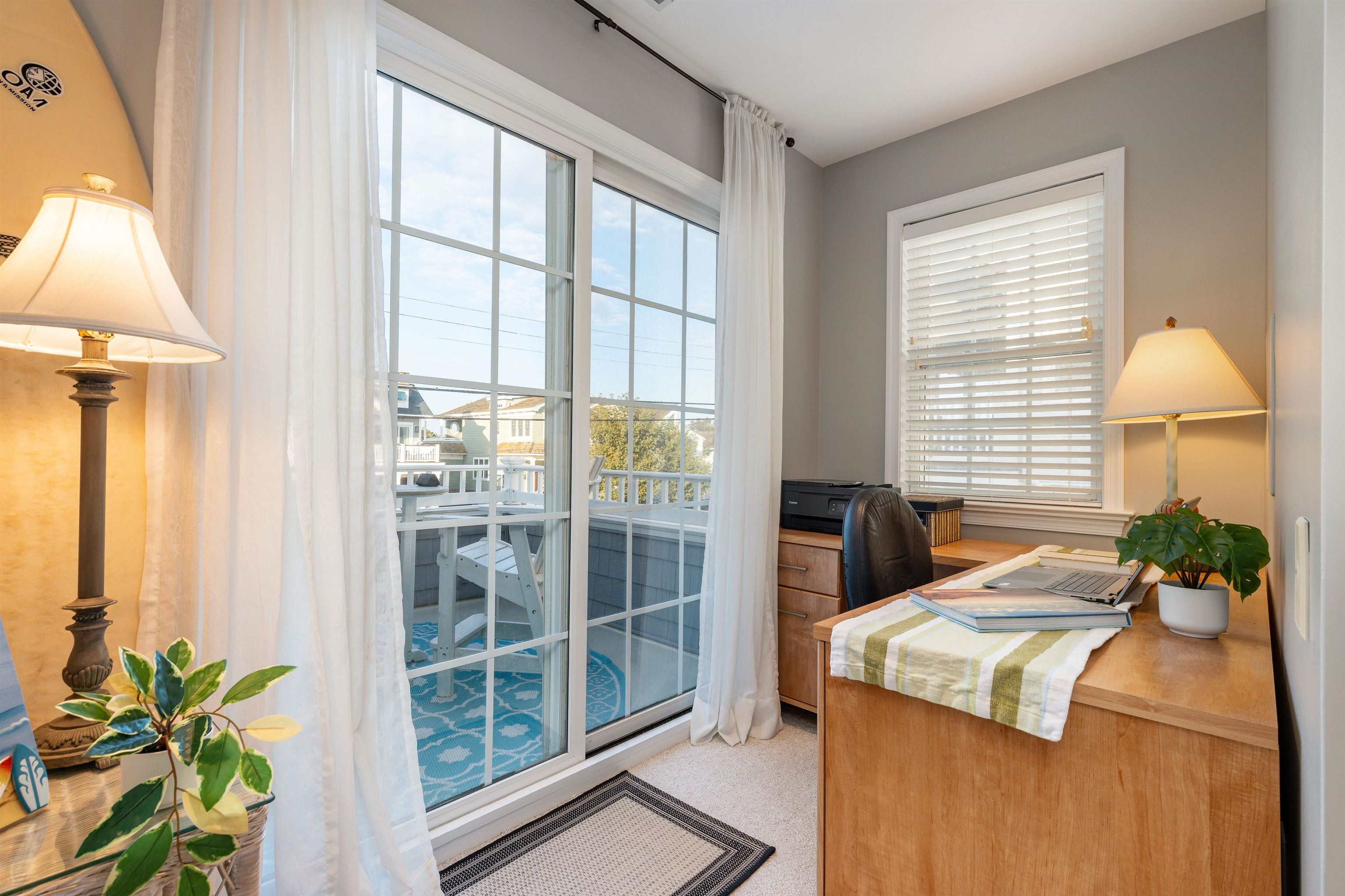 225 110th Street Stone Harbor, NJ 08247 - Photo 11 of 45 a bedroom with a bed and a potted plant
