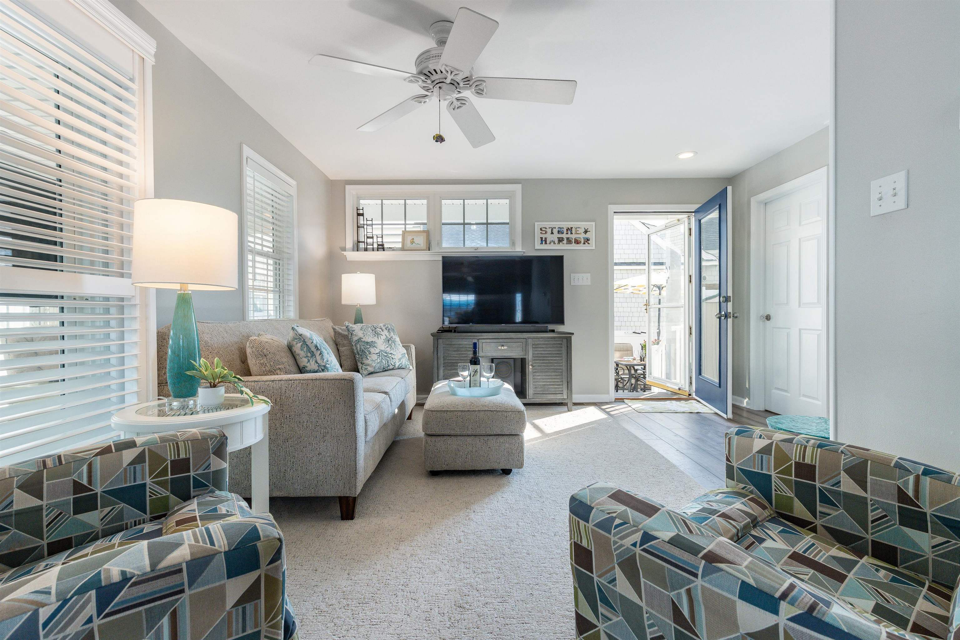 225 110th Street Stone Harbor, NJ 08247 - Photo 12 of 45 a living room with furniture and a flat screen tv