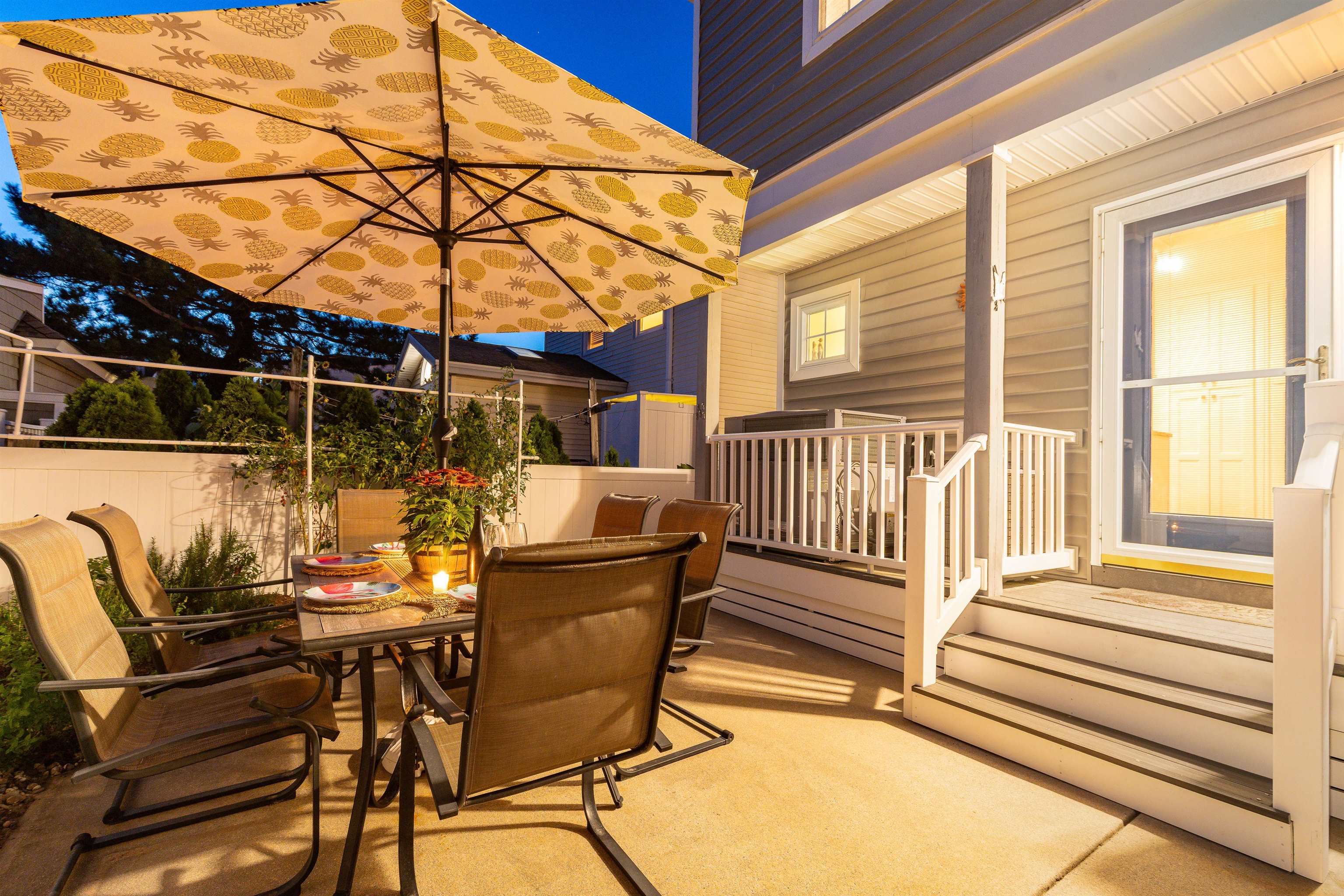 225 110th Street Stone Harbor, NJ 08247 - Photo 3 of 45 a view of a patio with table and chairs with wooden floor and fence