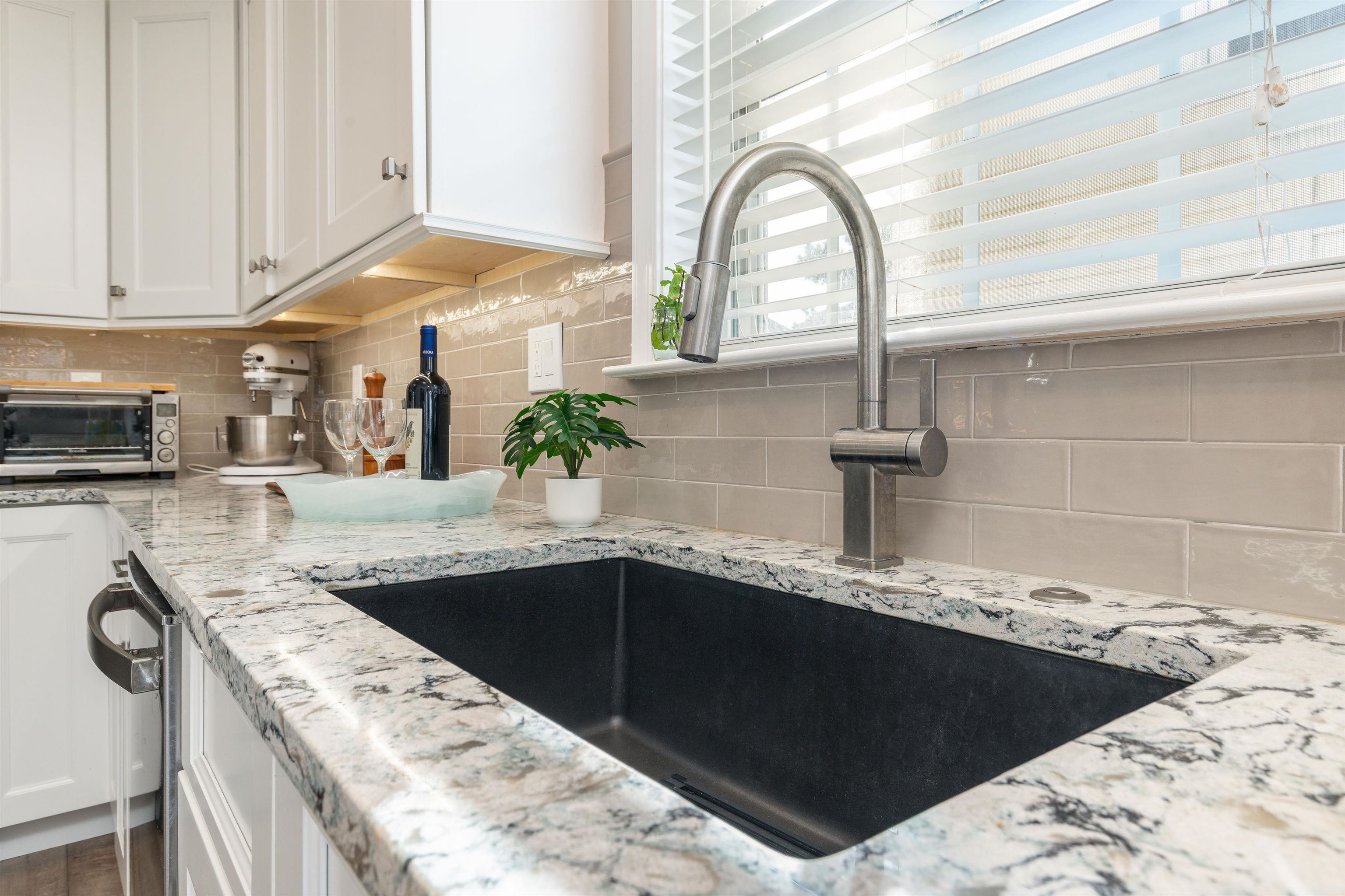 225 110th Street Stone Harbor, NJ 08247 - Photo 36 of 45 a kitchen with a sink and a stove