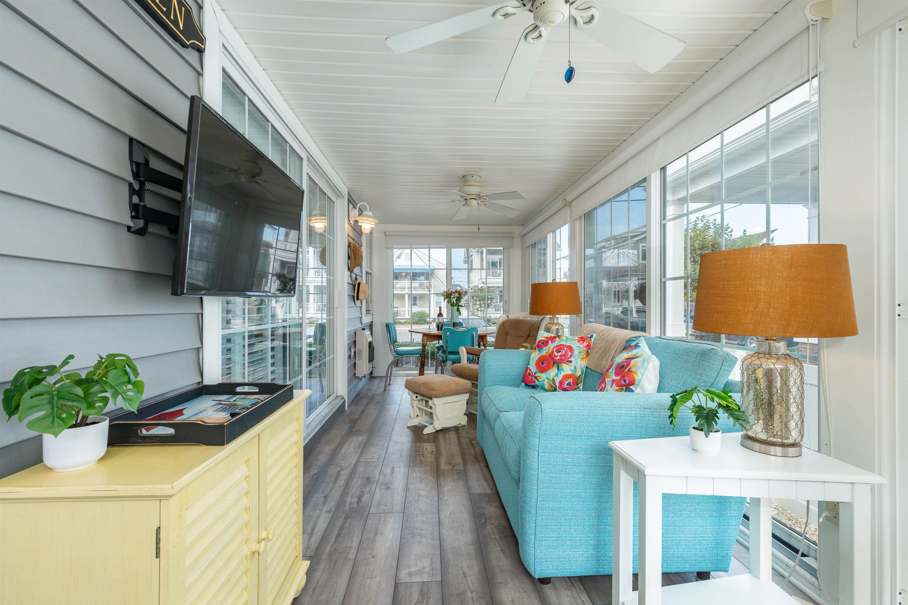 225 110th Street Stone Harbor, NJ 08247 - Photo 41 of 45 a living room filled with furniture and a chandelier