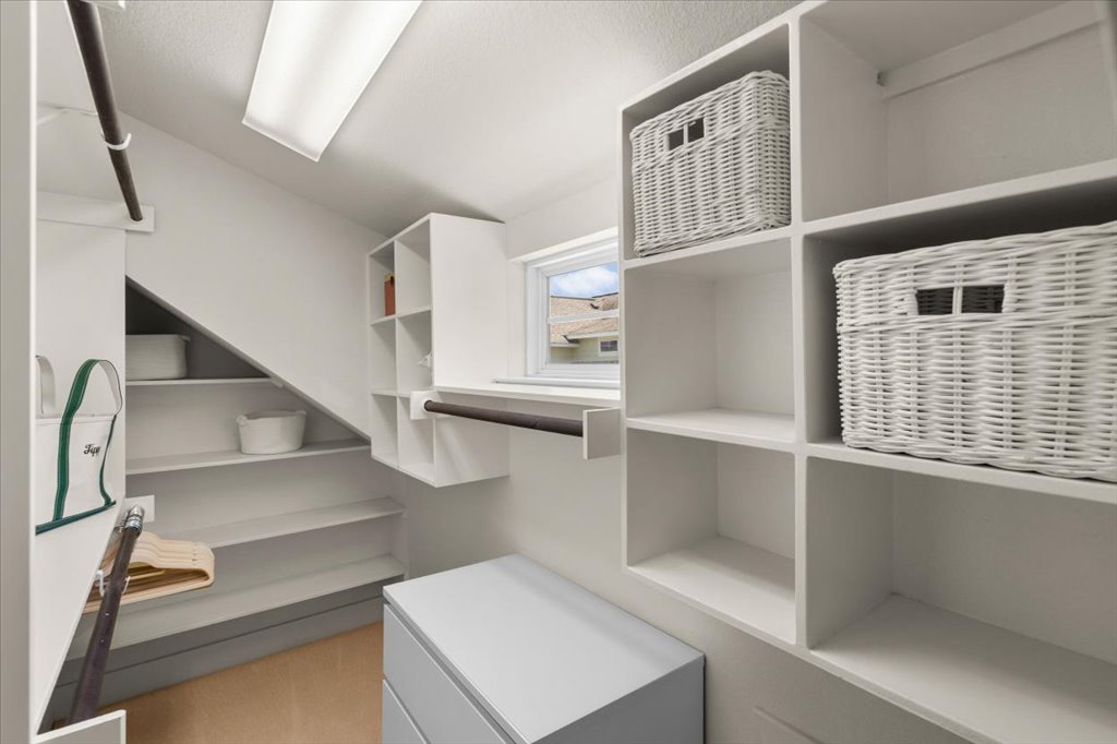 12200 Tawny Farms Road, Unit 139 Austin, TX 78748 - Photo 22 of 30 You are going to love the storage in this house. This walk-in closet features custom built-in cubbies and hanging rods that maximize the sloped roofline perfectly.