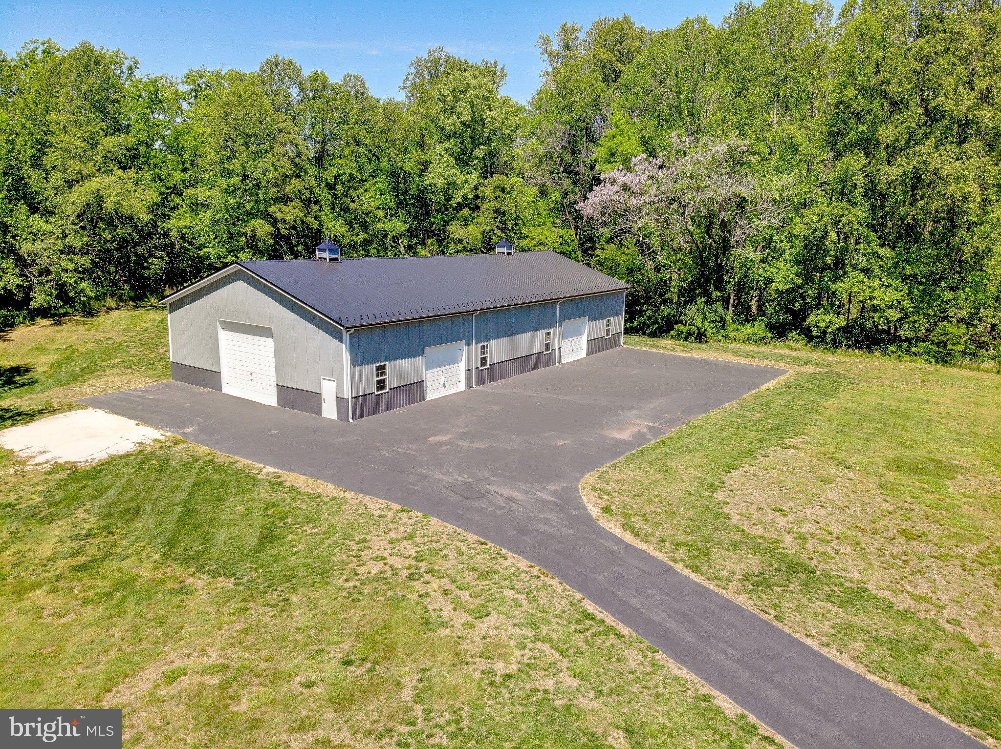 2393 Garrity Road St. Leonard, MD 20685 - Photo 9 of 76 Spacious garage nestled in nature.
