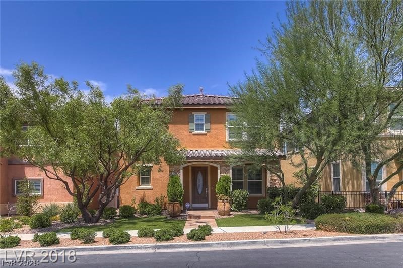 3144 Whitfeild Avenue Henderson, NV 89044 - Photo 43 of 55 A terracotta-hued facade with decorative shutters creates an inviting and charming curb appeal.