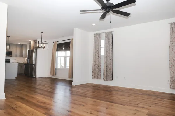 a view of a kitchen with a sink and a window