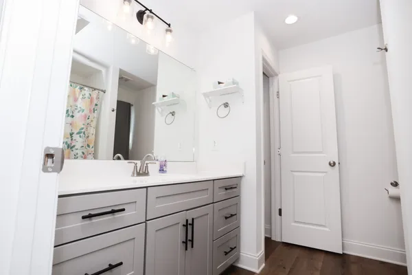 a bathroom with a sink and a mirror
