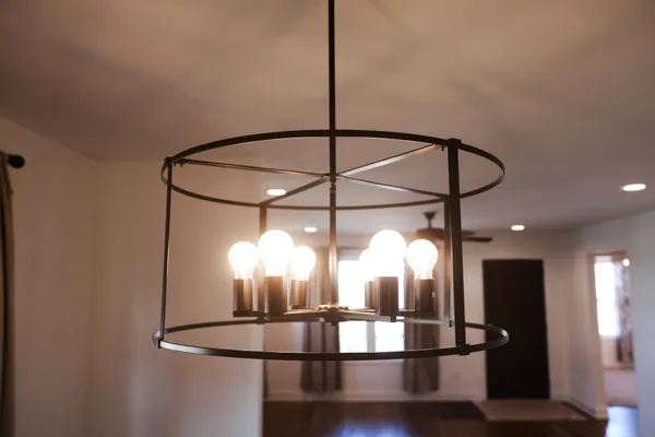 a room with lots of chandelier and a window