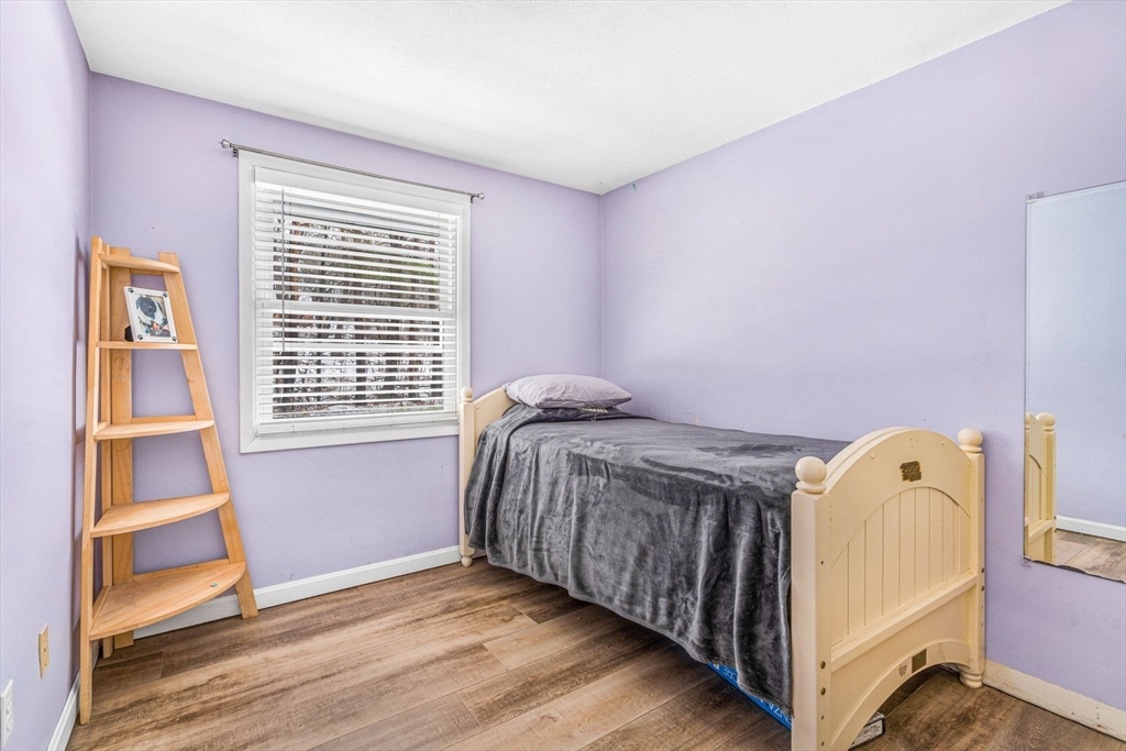 4 Temi Road Hudson, MA 01749 - Photo 19 of 23 a bedroom with a bed and a window