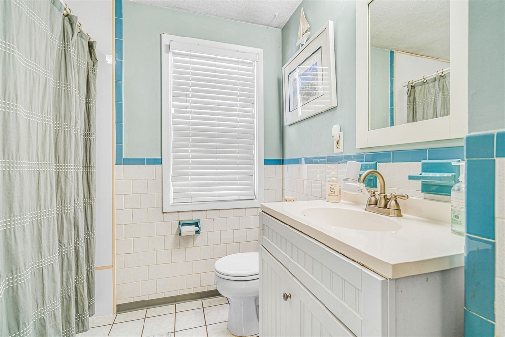 4 Temi Road Hudson, MA 01749 - Photo 21 of 23 a bathroom with a sink a toilet and shower