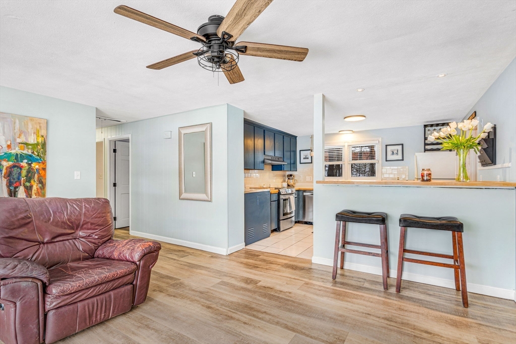 4 Temi Road Hudson, MA 01749 - Photo 4 of 23 a living room with furniture and a wooden floor