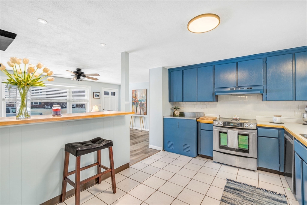 4 Temi Road Hudson, MA 01749 - Photo 5 of 23 a kitchen with stainless steel appliances granite countertop a sink and cabinets
