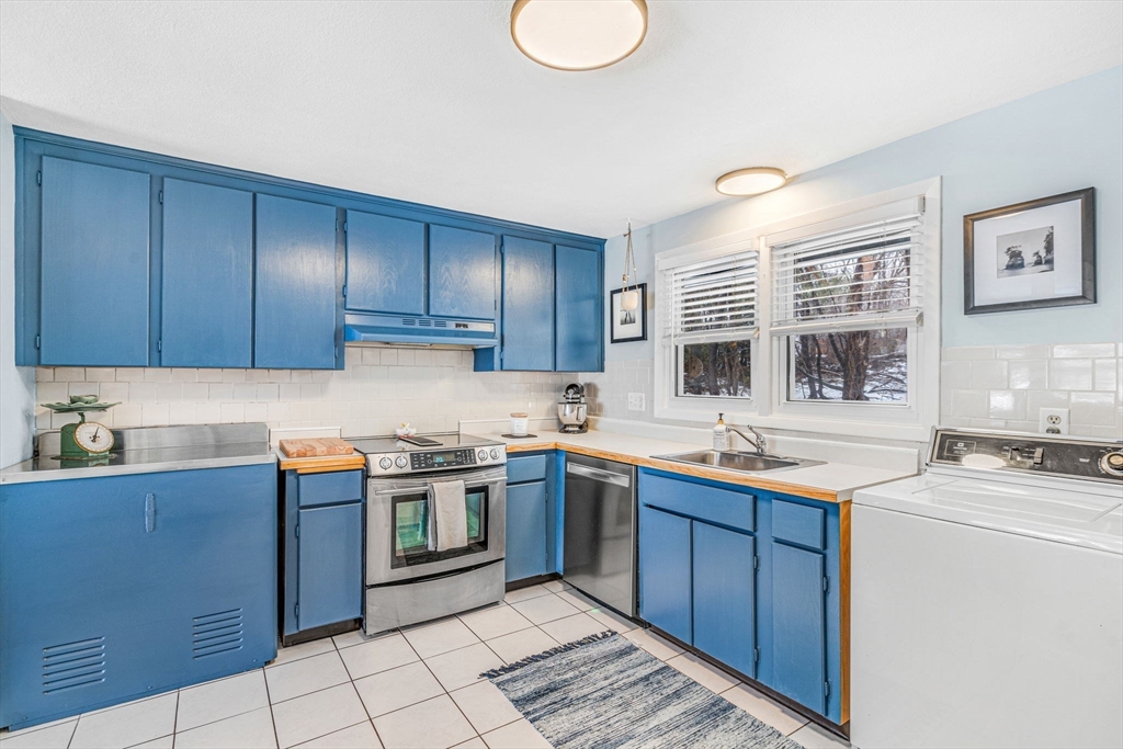 4 Temi Road Hudson, MA 01749 - Photo 7 of 23 a kitchen with stainless steel appliances granite countertop a sink stove and cabinets