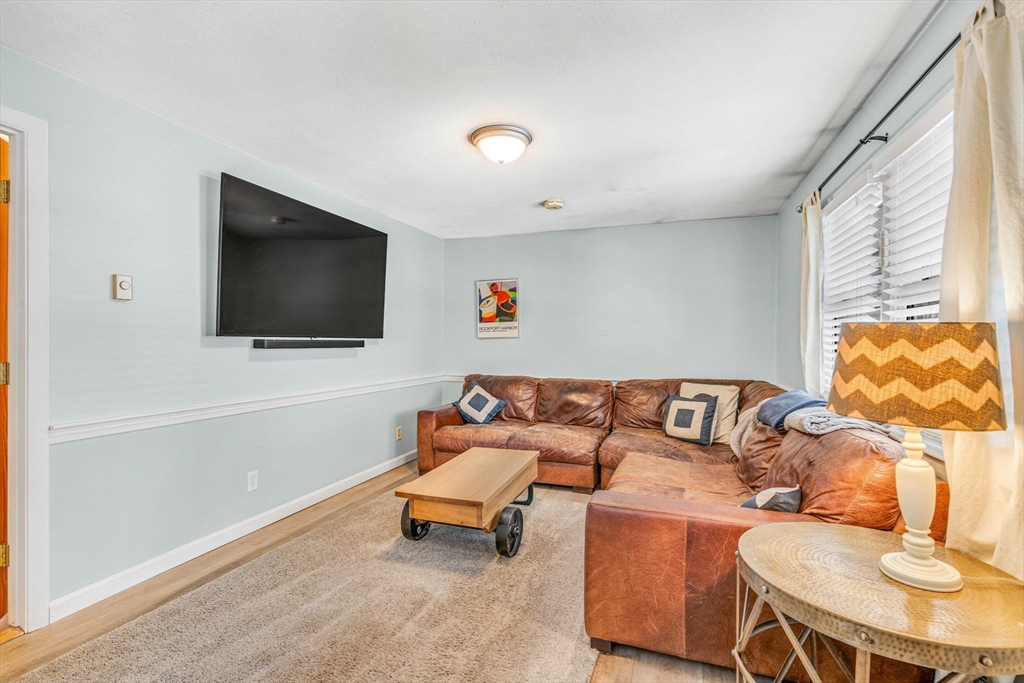 4 Temi Road Hudson, MA 01749 - Photo 8 of 23 a living room with furniture and a flat screen tv