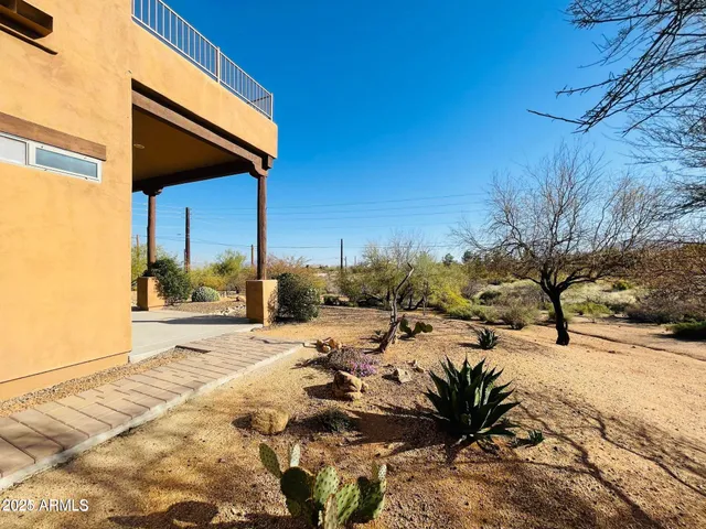 a view of a dirt road with trees