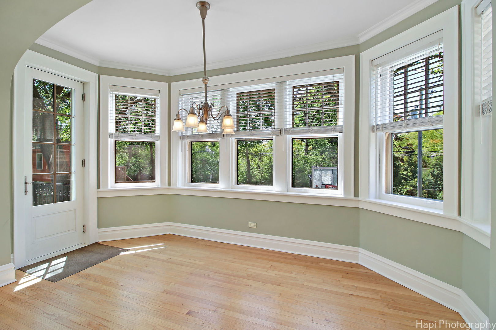 1403 Glenview Road Glenview, IL 60025 - Photo 15 of 62 a view of an empty room with a window and wooden floor