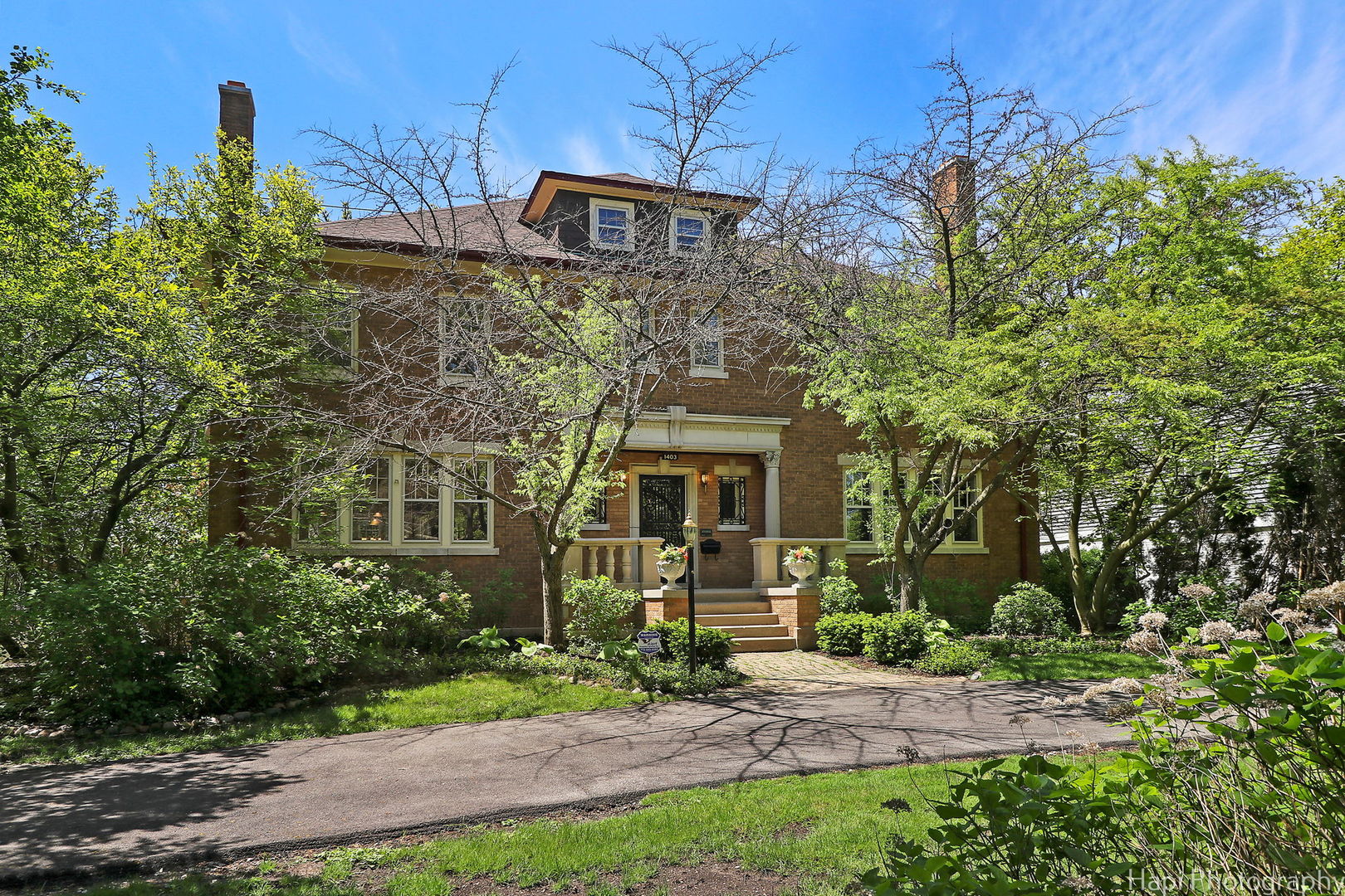1403 Glenview Road Glenview, IL 60025 - Photo 2 of 62 a front view of a house with garden