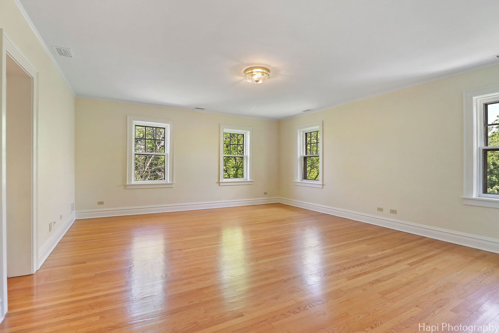 1403 Glenview Road Glenview, IL 60025 - Photo 27 of 62 an empty room with wooden floor and windows