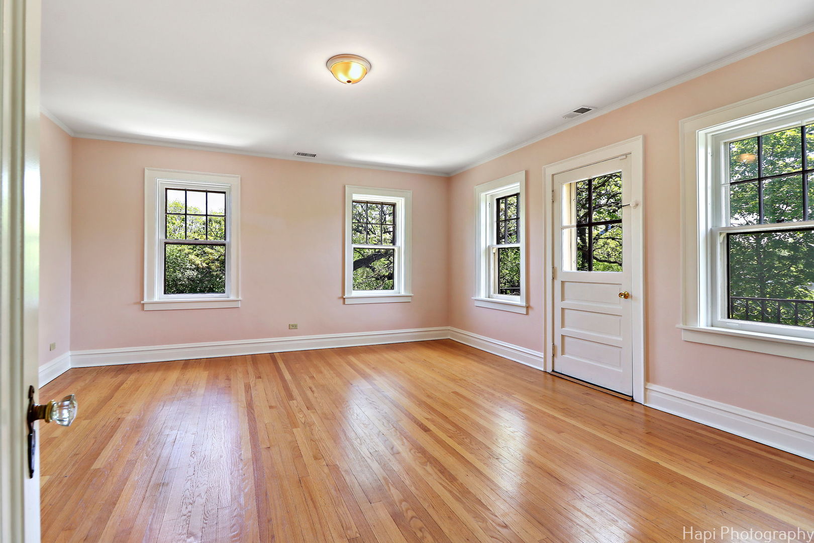 1403 Glenview Road Glenview, IL 60025 - Photo 33 of 62 an empty room with wooden floor and windows