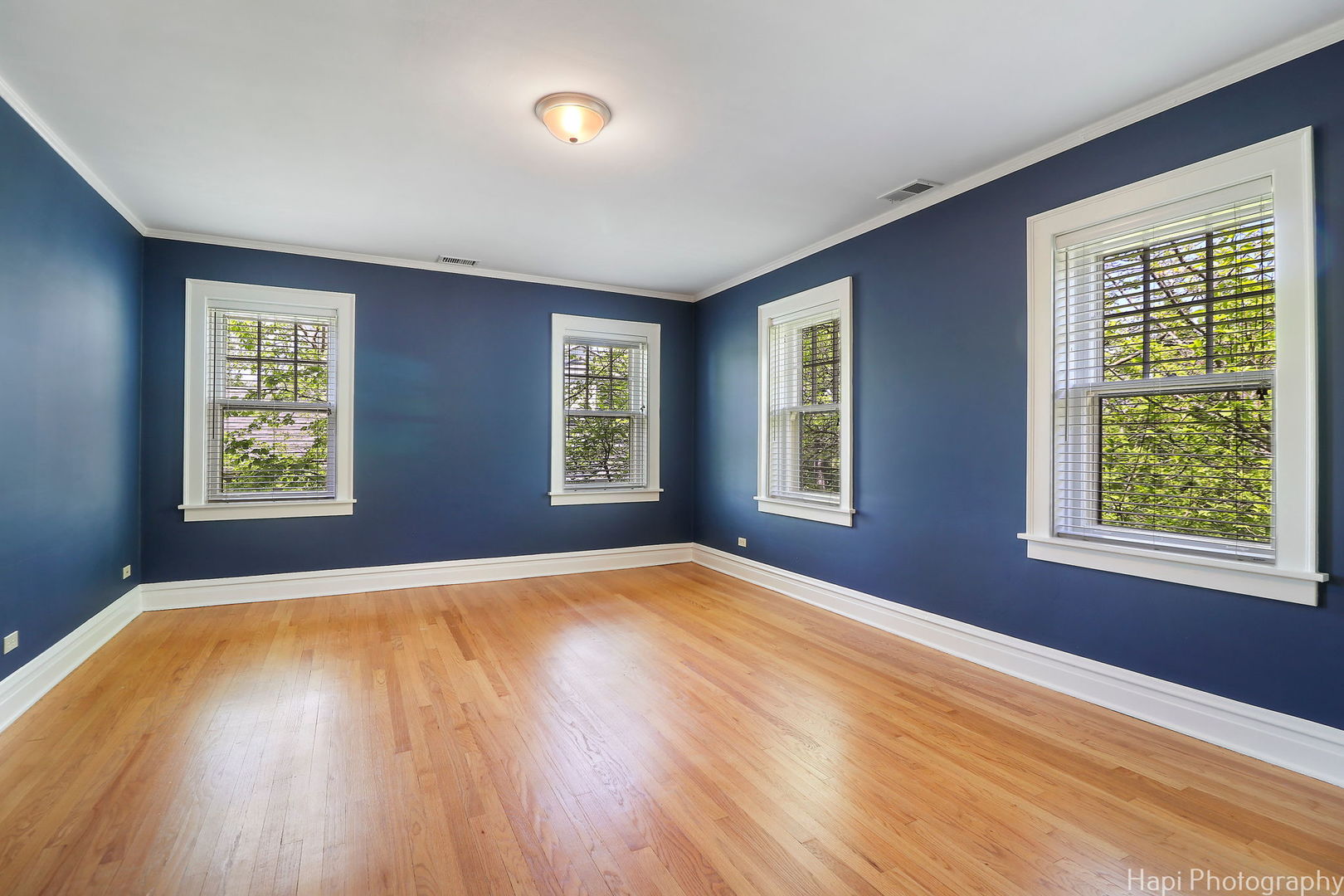 1403 Glenview Road Glenview, IL 60025 - Photo 38 of 62 a view of an empty room with a window and wooden floor