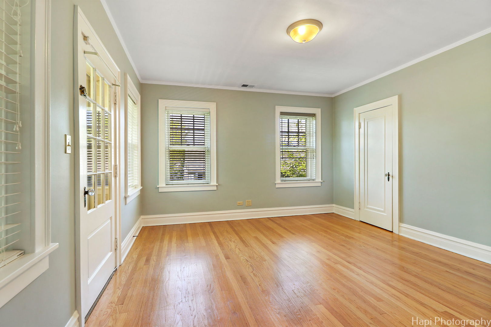 1403 Glenview Road Glenview, IL 60025 - Photo 40 of 62 a view of an empty room with glass door and wooden floor