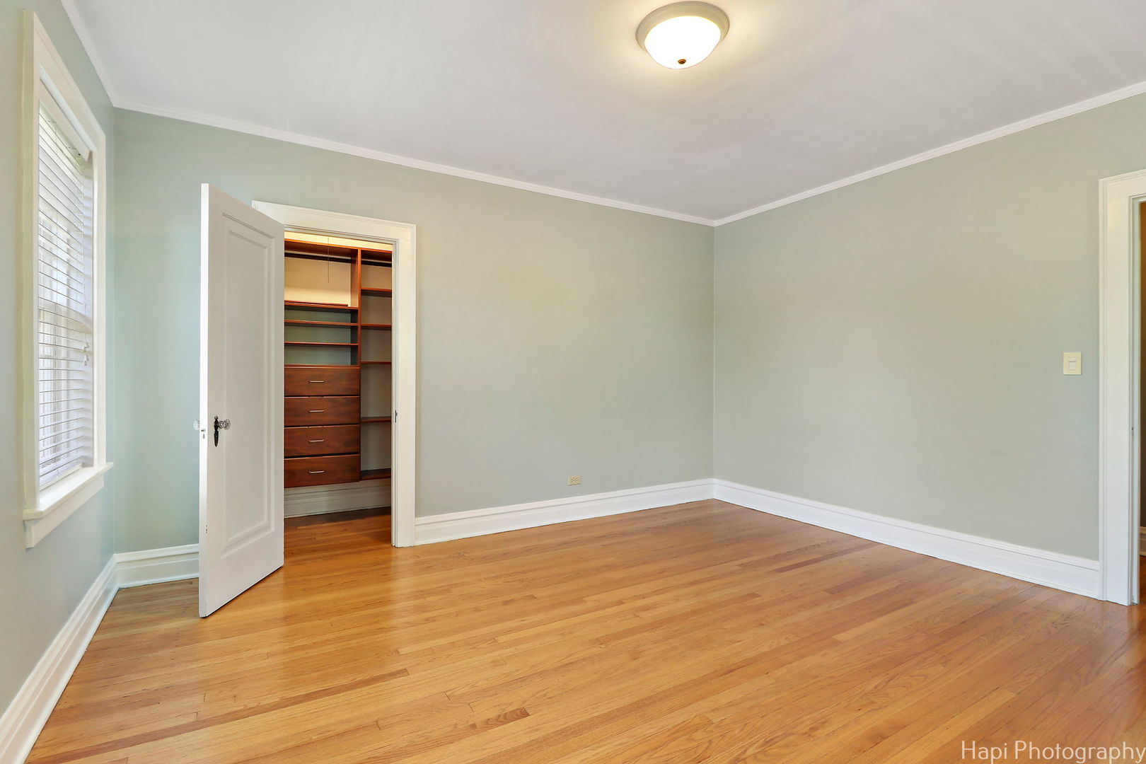 1403 Glenview Road Glenview, IL 60025 - Photo 41 of 62 an empty room with wooden floor closet and windows