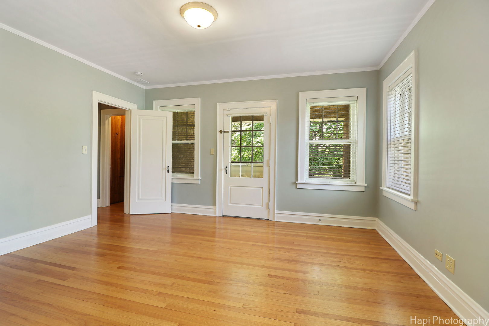 1403 Glenview Road Glenview, IL 60025 - Photo 42 of 62 an empty room with wooden floor and windows